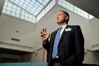 FILE - In this May 2016 file photo, Dr. Eric Arzubi, is shown in Billings, Mont. Arzubi is the CEO of Frontier Psychiatry, a telepsychiatry practice. Montana's health department has a federal grant for a pilot project that allows five OB-GYN clinics across the state to consult with Frontier Psychiatry to provide better and more immediate mental health care for women in the weeks before and after they give birth. The pilot program runs through 2023. (James Woodcock//The Billings Gazette via AP, File)
