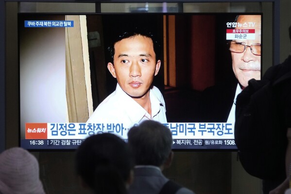 A TV screen shows a file image of Ri Il Kyu, a senior North Korea diplomat based in Cuba, during a news program at Seoul Railway Station in Seoul, South Korea, Tuesday, July 16, 2024. South Korea's spy agency said Tuesday that Ri has fled to South Korea, the latest in a series of defections by members of the North's ruling elite in recent years. (AP Photo/Ahn Young-joon)