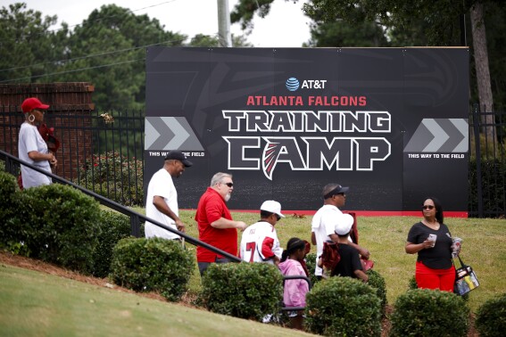 Atlanta Falcons fans attend the team's NFL football training camp on Saturday, July 29, 2023, in Flowery Branch, Ga. (AP Photo/Alex Slitz)