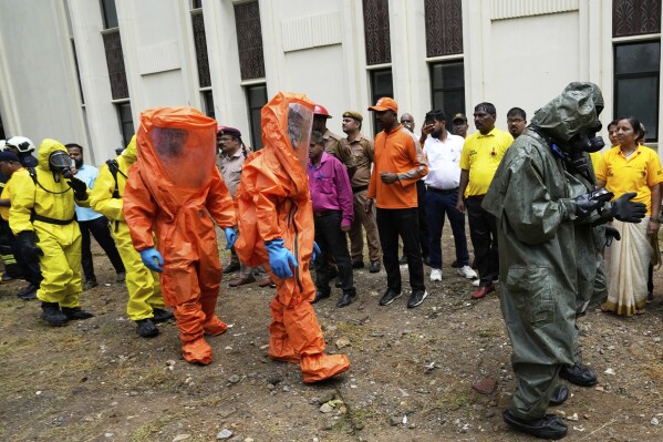 Civil Defense Services, National Disaster Response Force NDRF and Mumbai Fire Brigade workers take part in a mock drill in Mumbai, India, Wednesday, May 7, 2025, amid rising fears of wider conflict following India's strikes in Pakistan. (AP Photo/Rajanish Kakade)
