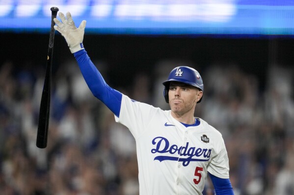 Freddie Freeman's World Series grand slam sparks a joyous family moment in a difficult year | AP News
