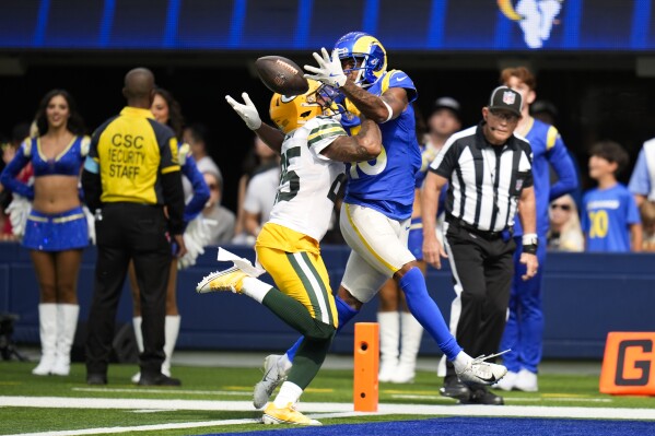 Green Bay Packers cornerback Keisean Nixon (25) breaks up a pass against Los Angeles Rams wide receiver Demarcus Robinson (15) during the first half of an NFL football game Sunday, Oct. 6, 2024, in Inglewood, Calif. (AP Photo/Gregory Bull)