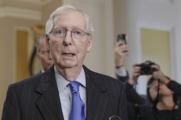 Senate Minority Leader Mitch McConnell, R-Ky., talks after a policy luncheon on Capitol Hill Tuesday, March 12, 2024, in Washington. (AP Photo/Mariam Zuhaib)