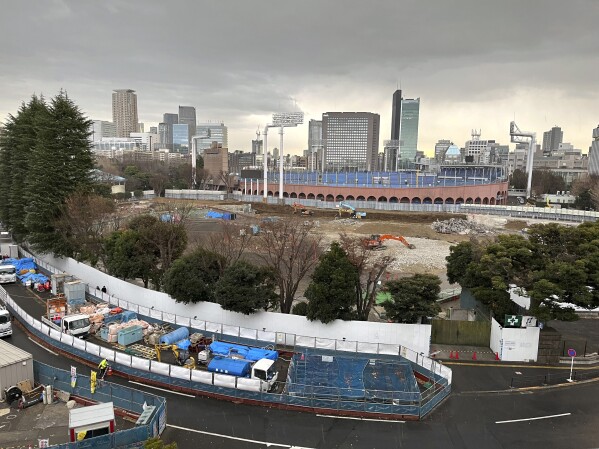FILE - A view of the expanse of trees around Tokyo's Jingu Gaien area that are slated to be cut in order to build three skyscrapers in one of the city's most beloved park areas Saturday, Jan. 13, 2024. The Japanese bar association is urging Tokyo's metropolitan government to suspend a disputed redevelopment of the city's beloved park area, saying that its environmental assessment by developers lacked objective and scientific grounds. (AP Photo/Stephen Wade, File)