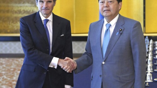 International Atomic Energy Agency head Rafael Mariano Grossi shakes hands with Foreign Minister Yoshimasa Hayashi before their meeting at the Iikura guesthouse in Tokyo, Tuesday, July 4, 2023. The head of the U.N. nuclear agency is in Japan to meet with government leaders Tuesday and to see final preparations for the release of treated radioactive wastewater into the sea from the damaged Fukushima nuclear plant, on a visit Japan hopes will give credibility to the contentious plan. (Nozomu Endo/Kyodo News via AP)