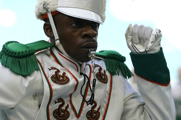 The Florida A&M University Marching 100 band performs during halftime of the Orange Blossom Classic NCAA college football game against Jackson State, Sunday, Sept. 3, 2023, in Miami Gardens, Fla. (AP Photo/Lynne Sladky)