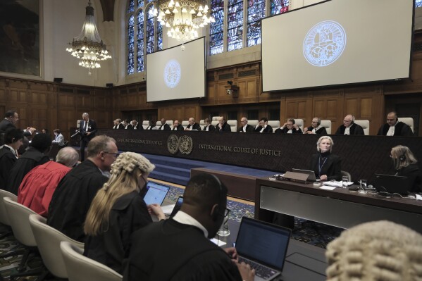 Judges and parties sit during a hearing at the International Court of Justice in The Hague, Netherlands, Friday, Jan. 12, 2024. The United Nations' top court opened hearings Thursday into South Africa's allegation that Israel's war with Hamas amounts to genocide against Palestinians, a claim that Israel strongly denies. (AP Photo/Patrick Post)