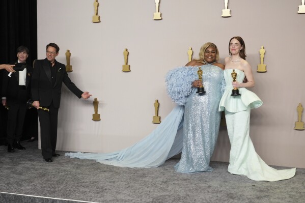 Cillian Murphy, winner of the award for best performance by an actor in a leading role for "Oppenheimer," from left, Robert Downey Jr., winner of the award for best performance by an actor in a supporting role for "Oppenheimer," Da'Vine Joy Randolph, winner of the award for best performance by an actress in a supporting role for "The Holdovers," and Emma Stone, winner of the award for best performance by an actress in a leading role for "Poor Things," pose in the press room at the Oscars on Sunday, March 10, 2024, at the Dolby Theatre in Los Angeles. (Photo by Jordan Strauss/Invision/AP)
