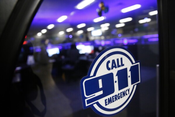 FILE - A police 911 call center is pictured on May 3, 2019, in Dallas. Emergency call center workers say their centers are understaffed, struggling to hire new staff and plagued by worker burnout, according to a national survey released Tuesday, July 25, 2023. (Rose Baca/The Dallas Morning News via AP, File)