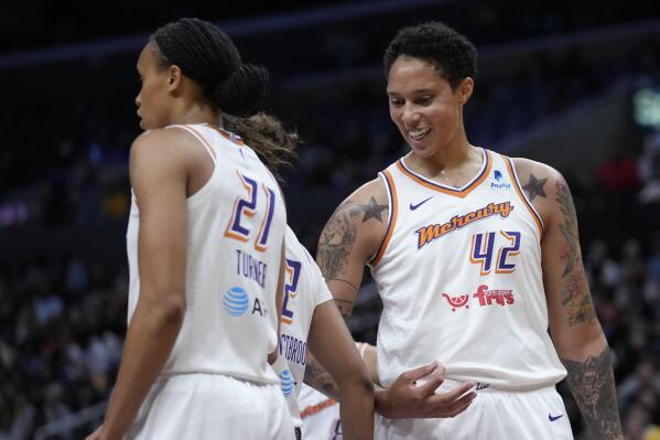 Phoenix Mercury center Brittney Griner (42) celebrates a foul with teammates during the first half of a WNBA basketball game against the Los Angeles Sparks in Los Angeles, Friday, May 19, 2023. (AP Photo/Ashley Landis)