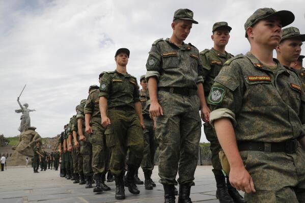 FILE - Russian army soldiers march during an action in support for the soldiers involved in the military operation in Ukraine, at the Mamaev Kurgan, a World War II memorial in Volgograd, Russia, July 11, 2022. Russian President Vladimir Putin has on Thursday, Aug. 25 ordered the Russian military to increase the size of the country's armed forces by 137,000 amid Moscow’s military action in Ukraine. (AP Photo/Alexandr Kulikov, file)