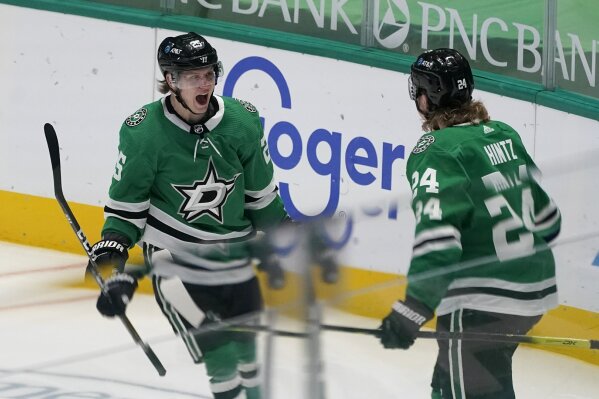 Dallas Stars' Joel Kiviranta, left, and left wing Roope Hintz (24) celebrate a goal by Kiviranta during the first period of the team's NHL hockey game against the Chicago Blackhawks in Dallas, Tuesday, March 9, 2021. (AP Photo/Tony Gutierrez)