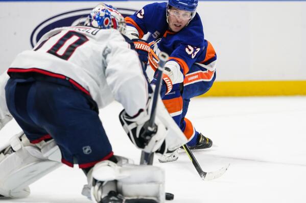 New York Islanders' Casey Cizikas (53) attempts to shoot the puck past Columbus Blue Jackets goaltender Joonas Korpisalo (70) during the second period of an NHL hockey game Thursday, Dec. 29, 2022, in Elmont, N.Y. (AP Photo/Frank Franklin II)