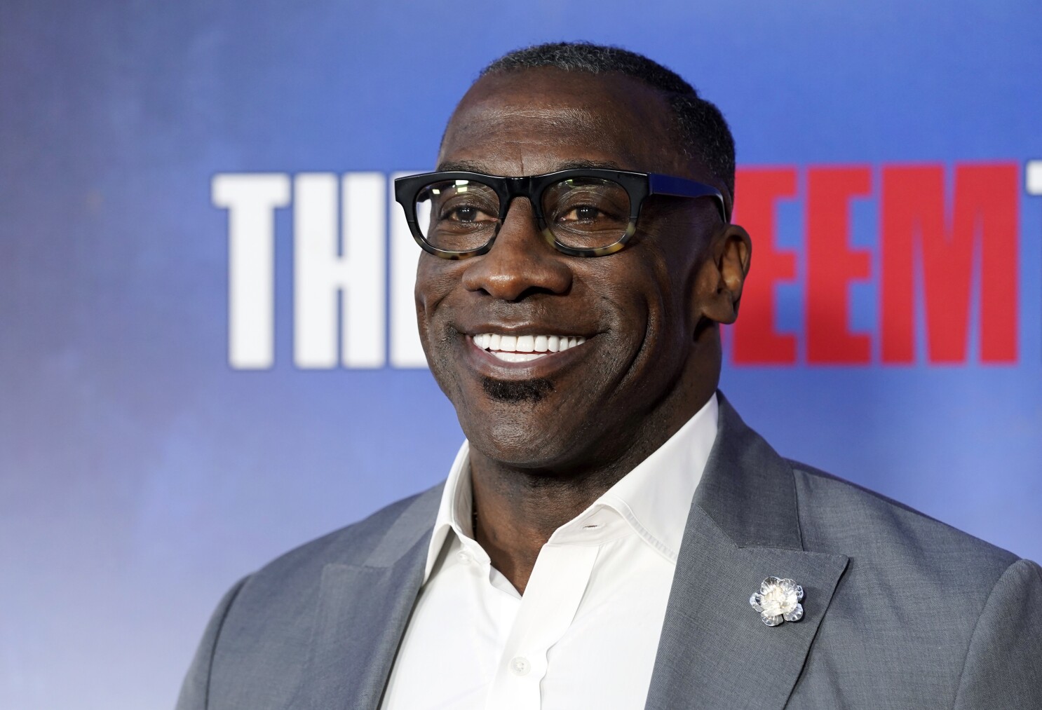 Shannon Sharpe is stepping away temporarily from ESPN amid sexual assault lawsuit | AP News