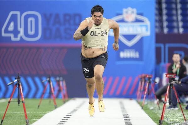 Oregon State offensive lineman Taliese Fuaga runs the 40-yard dash at the NFL football scouting combine, Sunday, March 3, 2024, in Indianapolis. Fuaga is a possible first round pick in the NFL Draft. (AP Photo/Michael Conroy, File)