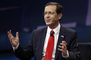 FILE - In this Monday, March 27, 2017, file photo, Isaac Herzog speaks at the AIPAC Policy Conference in Washington. The Israeli parliament on Wednesday, June 2, 2021, is set to choose the country's next president, a largely figurehead position that is meant to serve as the nation's moral compass and promote unity. Two candidates are running — Herzog, a veteran politician and scion of a prominent Israeli family, and Miriam Peretz, an educator who is seen as a down-to-earth outsider. (AP Photo/Manuel Balce Ceneta, File)