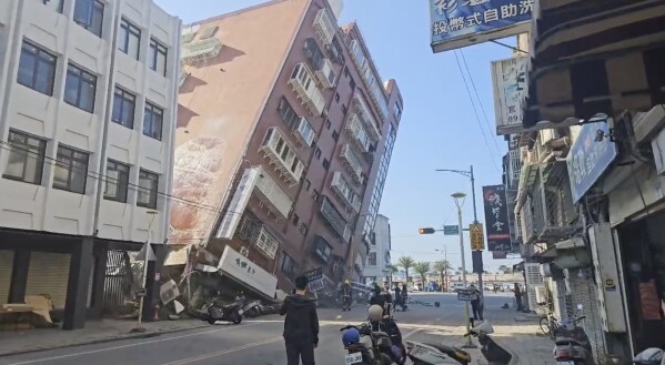 In this image taken from a video footage run by TVBS, a partially collapsed building is seen in Hualien, eastern Taiwan on Wednesday, April 3, 2024. A powerful earthquake rocked the entire island of Taiwan early Wednesday, collapsing buildings in a southern city and creating a tsunami that washed ashore on southern Japanese islands.(TVBS via AP)