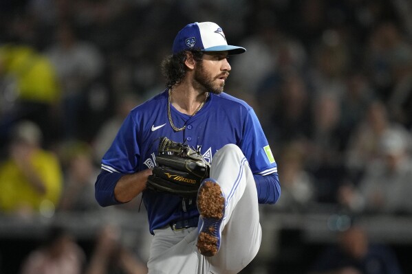 Toronto Blue Jays relief pitcher Jordan Romano throws during the fourth inning of a spring training baseball game against the New York Yankees Friday, March 1, 2024, in Tampa, Fla. (AP Photo/Charlie Neibergall)