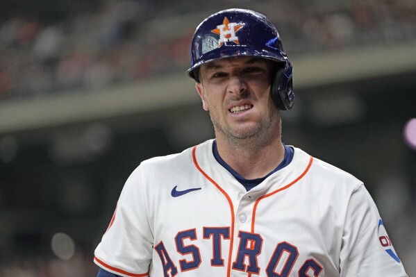 Houston Astros' Alex Bregman reacts after being hit by a pitch thrown by St. Louis Cardinals starting pitcher Andre Pallante during the first inning of a baseball game Tuesday, June 4, 2024, in Houston. (AP Photo/David J. Phillip)