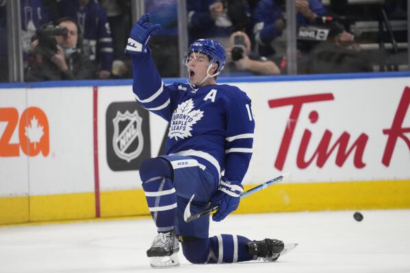 Toronto Maple Leafs right wing Mitchell Marner (16) celebrates after scoring on Nashville Predators during the third period of an NHL hockey game, Wednesday, Jan. 11, 2023 in Toronto. (Frank Gunn/The Canadian Press via AP)