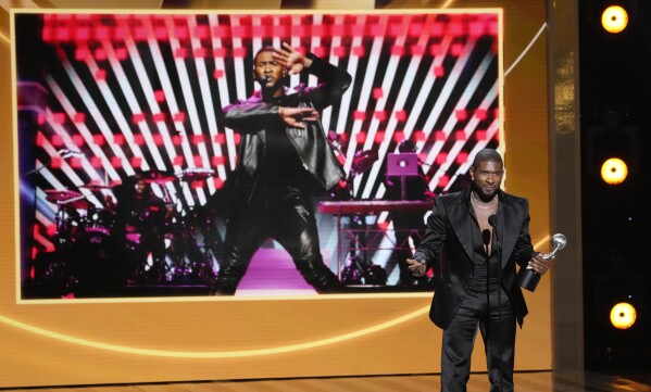 Usher speaks to the audience after winning Entertainer of the Year during the 55th NAACP Image Awards, Saturday, March 16, 2024, at The Shrine Auditorium in Los Angeles. (AP Photo/Chris Pizzello)