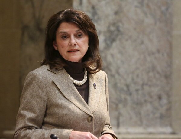 
              FILE - In this Nov. 7, 2017, file photo, state Sen. Leah Vukmir stands in the Senate chambers at the state Capitol in Madison, Wis. Vukmir, a candidate for U.S. Senate, has repeatedly attacked incumbent U.S. Sen. Tammy Baldwin, saying the Democrat failed to protect communities against sex offenders. Vukmir is one of two leading contenders for the Republican nomination to take on Baldwin in the November election, with national control of the Senate majority possibly at stake. (Michelle Stocker/The Capital Times via AP, File)
            