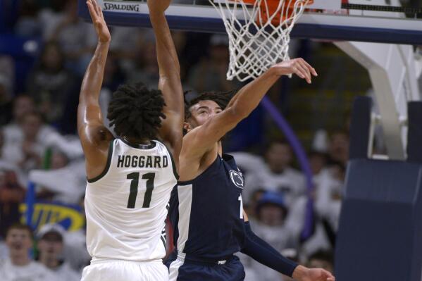 Penn State's Seth Lundy (1) defends against a shot by Michigan State's A.J. Hoggard (11) during the first half of an NCAA college basketball game Wednesday, Dec. 7, 2022, in State College, Pa. (AP Photo/Gary M. Baranec)