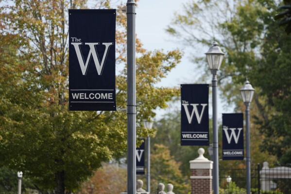 FILE - Mississippi University for Women banners decorate the campus in Columbus, Miss., Oct. 23, 2023. The university, which has also enrolled men since 1982, announced Wednesday, Feb. 21, 2024, that it would pause its effort to choose a new name that does not include the word 