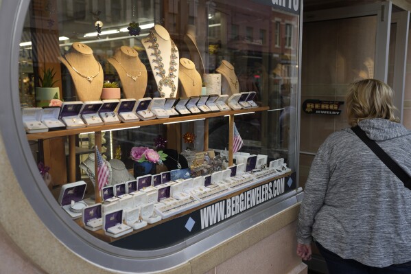 A shopper looks at items in the window of a jewelry store on Main Street Wednesday, Sept. 20, 2023, in Deadwood, S.D. On Tuesday, the Conference Board reports on U.S. consumer confidence for September. (AP Photo/David Zalubowski)