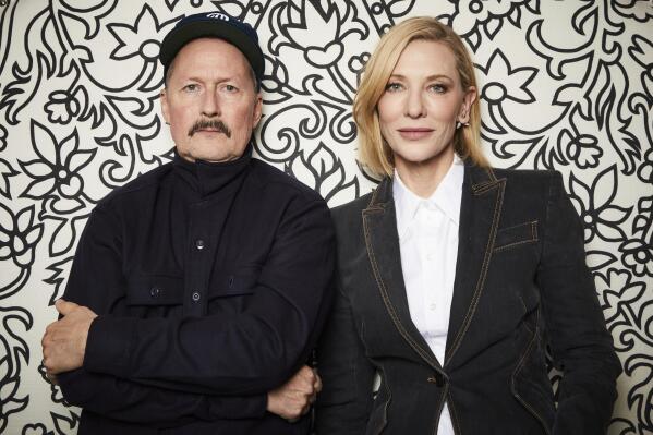Todd Field, left, and Cate Blanchett pose for a portrait on Oct. 2, 2022, in New York to promote the film Tár,” in which Blanchett plays a trailblazing conductor whose status is threatened amid a misconduct scandal of her own making. (Photo by Matt Licari/Invision/AP)