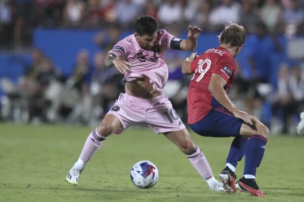 Inter Miami forward Lionel Messi (10) gets around FC Dallas midfielder Paxton Pomykal (19) during the second half of a Leagues Cup soccer match Sunday, Aug. 6, 2023, in Frisco, Texas. (AP Photo/LM Otero)
