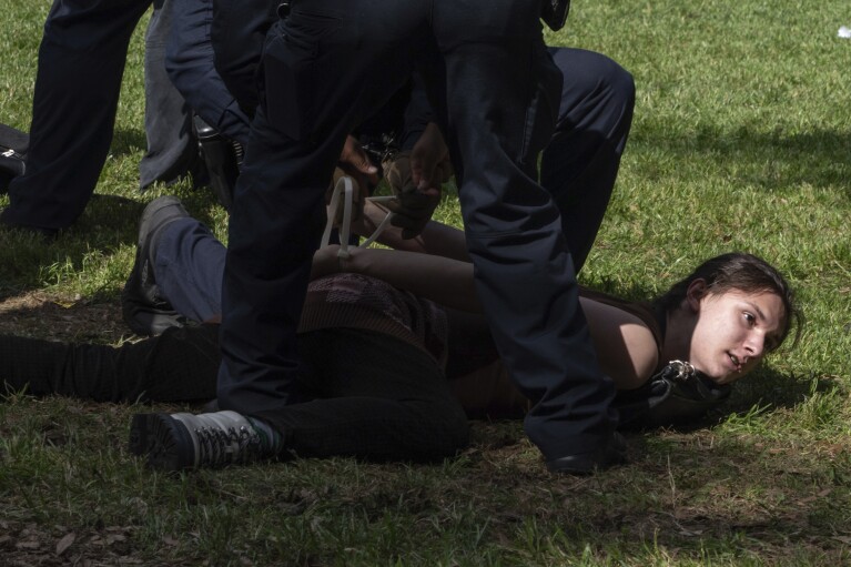 A protester is arrested by University of Texas police at a pro-Palestinian protest at the University of Texas, Wednesday, April 24, 2024, in Austin, Texas. (Mikala Compton/Austin American-Statesman via AP)