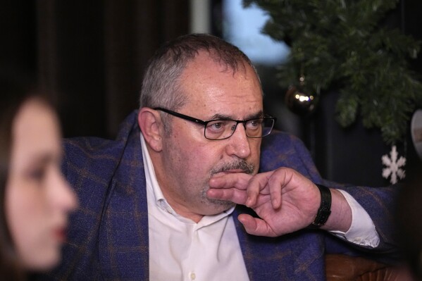 Boris Nadezhdin, a liberal Russian politician who aspires to run for president in March's presidential election, attends a meeting with soldiers' wives in Moscow, Russia, Thursday, Jan. 11, 2024. Wives of some of Russian soldiers who were called up for military service during a partial mobilization in 2022, have pushed for them to be discharged from the ranks. (AP Photo/Alexander Zemlianichenko)