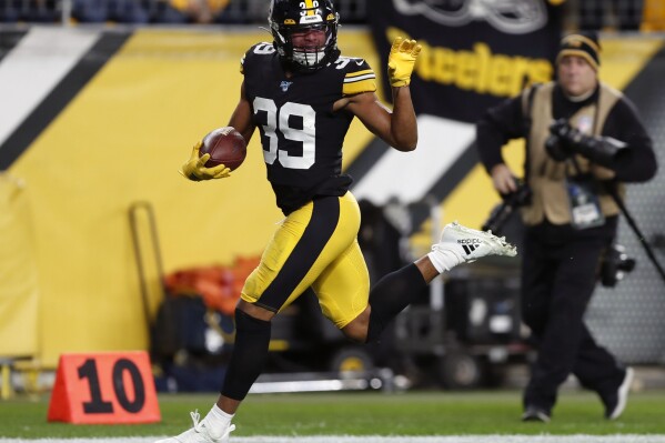 FILE - Pittsburgh Steelers free safety Minkah Fitzpatrick (39) runs for a touchdown after recovering a fumble by Los Angeles Rams quarterback Jared Goff during the first half of an NFL football game in Pittsburgh, Nov. 10, 2019. Once he got traded to the Pittsburgh Steelers, Fitzpatrick quickly emerged as one of the NFL's best playmakers at the position and was chosen as the top safety in the league by The Associated Press. (AP Photo/Keith Srakocic, File)