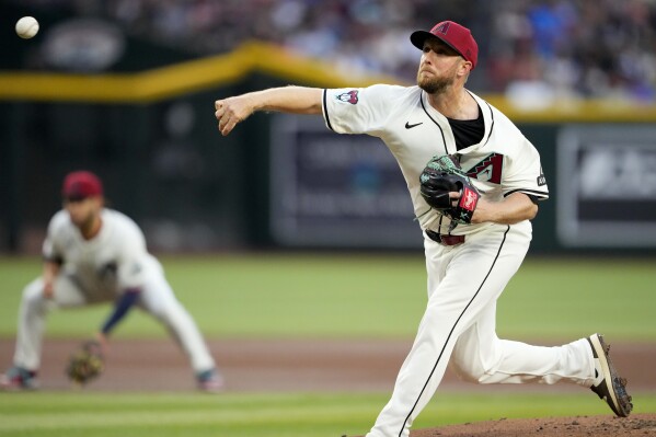 Arizona Diamondbacks starting pitcher Merrill Kelly throws against the Chicago Cubs during the first inning of a baseball game, Monday, April 15, 2024, in Phoenix. (AP Photo/Matt York)