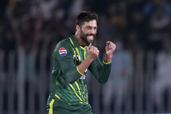Pakistan's Mohammad Amir celebrates after taking the wicket of New Zealand's Dean Foxcroft during the second T20 international cricket match between Pakistan and New Zealand, in Rawalpindi, Pakistan, Saturday, April 20, 2024. (AP Photo/Anjum Naveed)