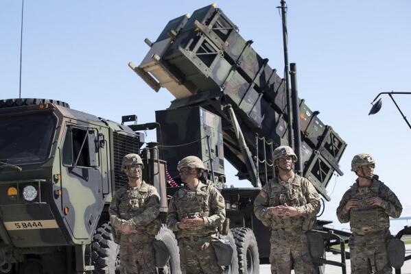 FILE - Members of US 10th Army Air and Missile Defense Command stands next to a Patriot surface-to-air missile battery during the NATO multinational ground based air defence units exercise "Tobruq Legacy 2017" at the Siauliai airbase some 230 km. (144 miles) east of the capital Vilnius, Lithuania, on July 20, 2017. Ukraine’s defense minister said Wednesday April 19, 2023 his country has received U.S-made Patriot surface-to-air guided missile systems it has long craved and which Kyiv hopes will help shield it from Russian strikes during the war. (AP Photo/Mindaugas Kulbis, File)