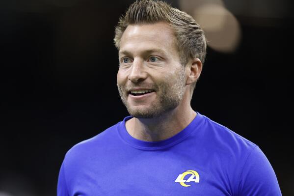 FILE - Los Angeles Rams head coach Sean McVay watches as players warm up before an NFL football game against the New Orleans Saints in New Orleans, Sunday, Nov. 20, 2022. McVay says he's back for the long term with the Rams. The youngest coach in NFL history to win the Super Bowl says he made a decision for years to come when he elected to stick with the Rams in January. (AP Photo/Butch Dill, File)