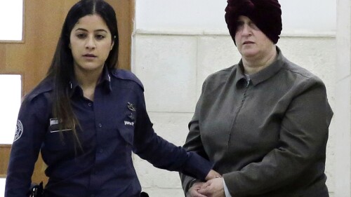 FILE - Israeli-born Australian Malka Leifer, right, is brought to a courtroom in Jerusalem on Feb. 27, 2018. Leifer, a former principal of an Australian Jewish school, will be sentenced on Aug. 24 on convictions for sexually abusing two students, a judge said on Friday, July 21, 2023. (AP Photo/Mahmoud Illean, File)