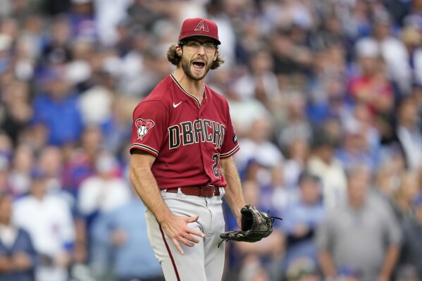 Arizona Diamondbacks starting pitcher Zac Gallen reacts after the final out in his complete game shutout of the Chicago Cubs in a baseball game Friday, Sept. 8, 2023, in Chicago. (AP Photo/Charles Rex Arbogast)