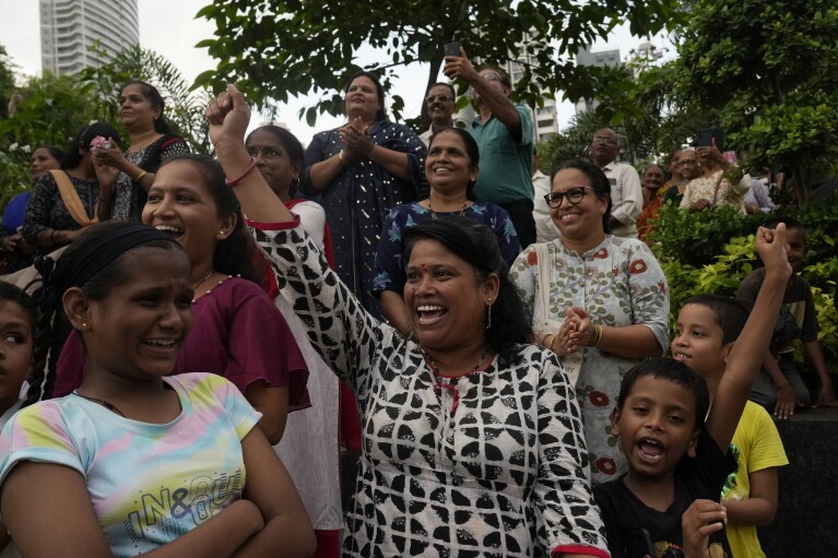 People celebrate as they watch a live telecast of the landing og Chandrayaan-3, or “moon craft” in Sanskrit, in Mumbai, India, Wednesday, Aug. 23, 2023. (AP Photo/Rajanish Kakade)