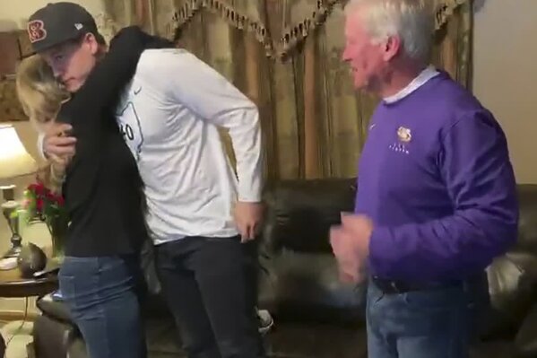 CORRECTS LOCATION TO THE PLAINS, OHIO, INSTEAD OF ATHENS, OHIO - In this still image from video provided by the NFL, LSU quarterback Joe Burrow celebrates, in The Plains, Ohio, after being chosen first by the Cincinnati Bengals during the NFL football draft, Thursday, April 23, 2020. (NFL via AP)