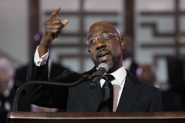 FILE - U.S. Sen. Raphael Warnock, D-Ga., a senior pastor at Ebenezer Baptist Church, speaks at the church, Jan. 15, 2023, in Atlanta. Warnock on Friday, Sept. 15, 2023, urged Atlanta's mayor to be more transparent in how city officials handle a petition drive led by opponents of a proposed police and firefighter training center, saying he is “closely monitoring” the issue. (AP Photo/Carolyn Kaster, File)