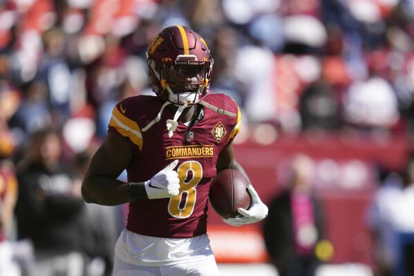 Robinson plays for Commanders 6 weeks since getting shot | AP News