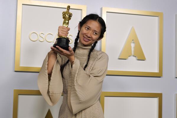 Director/Producer Chloe Zhao, winner of the award for best picture for "Nomadland," poses in the press room at the Oscars on Sunday, April 25, 2021, at Union Station in Los Angeles. (AP Photo/Chris Pizzello, Pool)