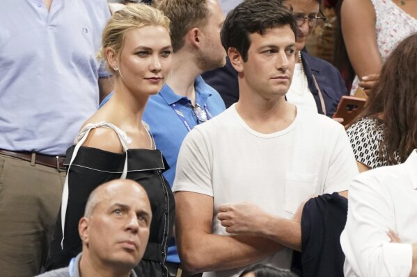 
              FILE - In this Sept. 6, 2018 file photo, Karlie Kloss, top left, and Joshua Kushner attend the semifinals of the U.S. Open tennis tournament at the USTA Billie Jean King National Tennis Center in New York. Supermodel Kloss has married businessman Joshua Kushner who is the younger brother of White House senior adviser Jared Kushner. Kloss posted a photo of her in a wedding dress and Kushner in a tuxedo - both of them beaming - on Instagram and Twitter Thursday night, Oct. 18, 2018. (Photo by Greg Allen/Invision/AP, File)
            