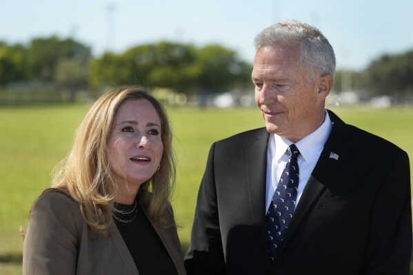 Former Rep. Debbie Mucarsel-Powell, D-Fla., left, speaks during a news conference alongside Navy Cmdr. (Ret.) Phil Ehr at the Memorial Cubano in Tamiami Park, Wednesday, Oct. 18, 2023, in Miami. Mucarsel-Powell, who is running for a Senate seat against Republican Rick Scott, endorsed Ehr for Congress. (AP Photo/Wilfredo Lee)