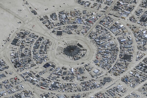 In this satellite photo provided by Maxar Technologies, an overview of Burning Man festival in Black Rock, Nev on Monday, Aug. 28, 2023. (©2023 Maxar Technologies via AP)