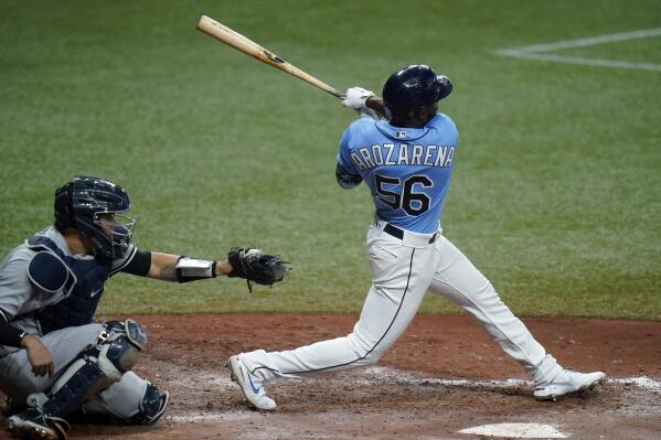 Tampa Bay Rays' Randy Arozarena connects for a three-run home run off New York Yankees pitcher Michael King during the sixth inning of a baseball game Thursday, May 13, 2021, in St. Petersburg, Fla. Catching for the Yankees is Gary Sanchez. (AP Photo/Chris O'Meara)