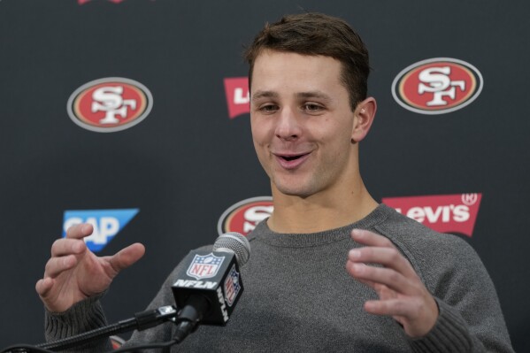 San Francisco 49ers quarterback Brock Purdy speaking to members of the media during a news conference after an NFL football game against the Washington Commanders, Sunday, Dec. 31, 2023, in Landover, Md. San Francisco won 27-10. (AP Photo/Alex Brandon)